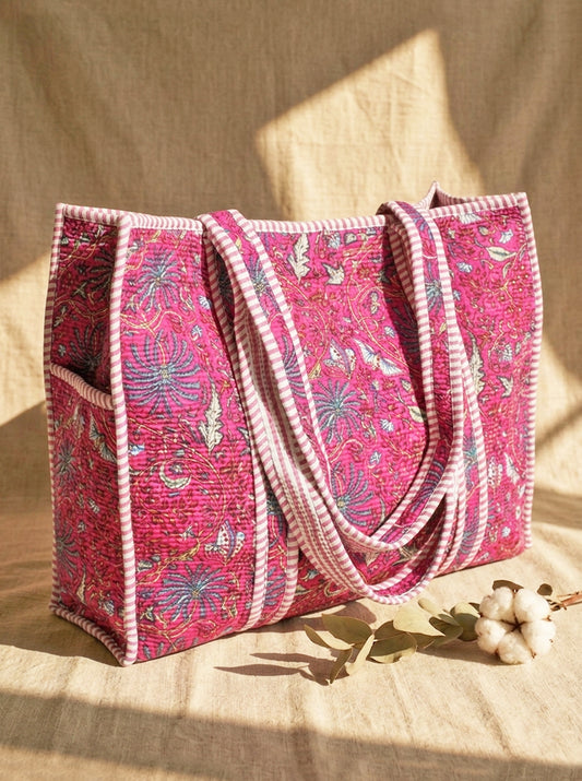 Pink floral tote bag on a natural background