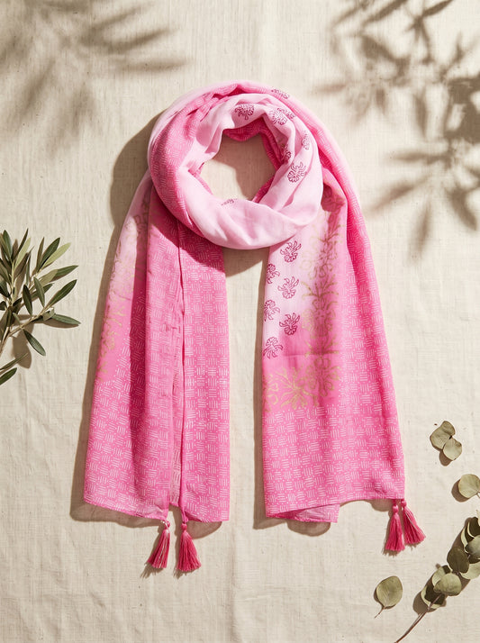 Pink block printed scarf on a beige background